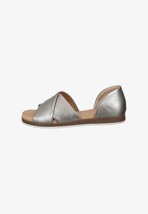 Silver leather sandal featuring a crossed strap design, open heel, natural textured sole, and a smooth insole.