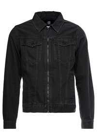 Giubbotto in denim nero con zip frontale, tasche sul petto con bottone, maniche lunghe e colletto classico.