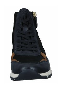 Black and brown suede lace-up sneaker with a rounded toe, textured finish, and a gold zipper accent on the side. Rubber sole.