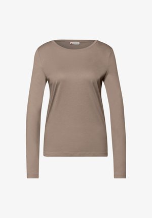 T-shirt beige à manches longues en tissu doux et lisse ; doté d'un col rond et d'une coupe ajustée avec des détails de couture minimalistes.