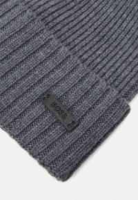Dark gray knitted beanie with a ribbed texture, featuring a black leather patch embossed with "BOSS" at the edge.