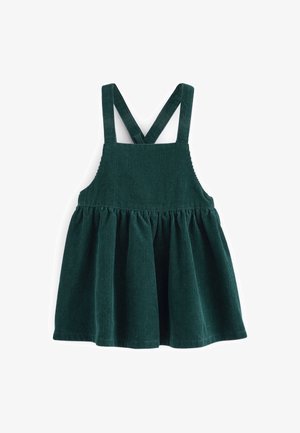 Robe pour tout-petit en velours côtelé vert foncé avec jupe froncée et bretelles croisées sur fond blanc.