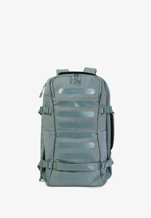 Sac à dos Hedgren gris avec plusieurs compartiments zippés, sangles latérales réglables, bretelles rembourrées et poignée de transport supérieure.