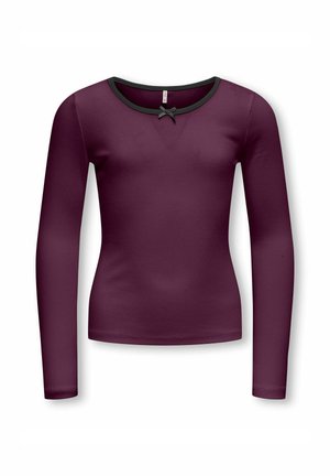 Lila, enganliegendes Langarmshirt mit schwarzem Besatz am Ausschnitt und einer kleinen schwarzen Schleife in der Mitte vorne.