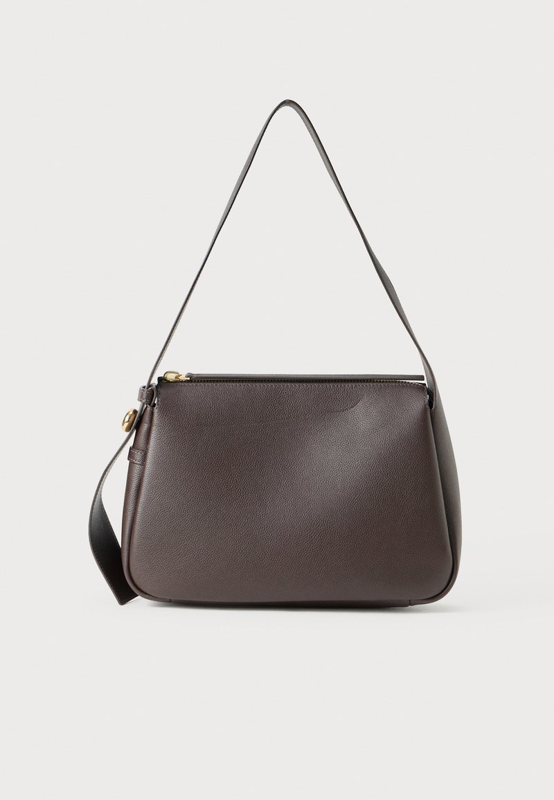 Brown leather shoulder bag with a curved shape, zipper closure, and an adjustable strap. Features a gold hardware accent. Smooth texture.