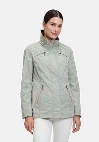 Light gray jacket with a high collar, zippered front, and two side pockets. Features stitching accents and contrasting zipper details.