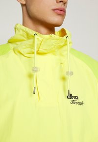 ELHO SALZBURG 89 UNISEX - Windjack - yellow/green