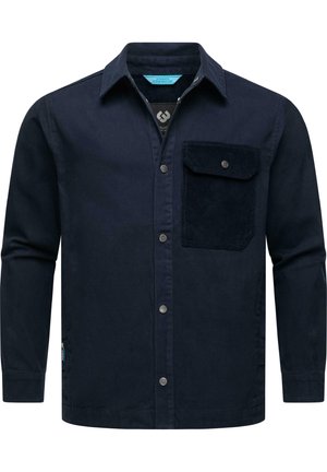 Navyblaues Hemd mit langen Ärmeln aus Baumwolle, mit Knopfleiste und einer aufgesetzten Tasche mit Cord-Struktur auf der linken Brust.