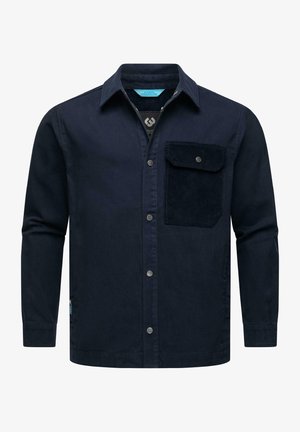 Tamsiai mėlyna medvilninė marškinėlių bliuzono tipo su ilgomis rankovėmis, priekyje su mygtukais ir kišene su veliūro tekstūra kairėje krūtinės pusėje.