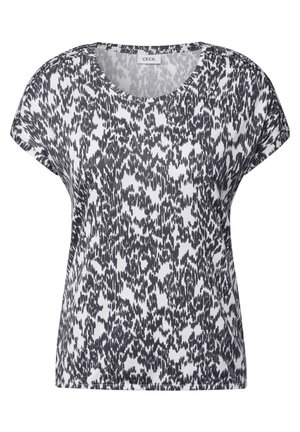 Haut à manches courtes noir et blanc à motifs, fabriqué en tissu doux ; présente un col rond et une coupe décontractée avec des épaules tombantes.