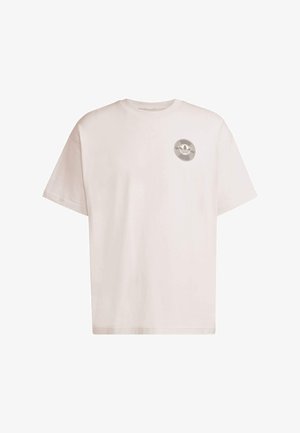 Light-colored cotton t-shirt featuring a round neck, short sleeves, and a circular logo on the left chest area. Simple and unembellished design.