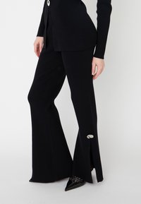 MIRA - Leggings - Calças - black