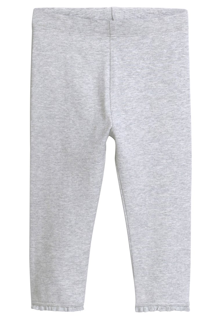 Grå bomuldsleggings med elastisk talje, tætsiddende pasform og flæse detalje i kanten. Stoffet har et blødt, tekstureret udseende.