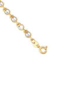 Bracelet doré mettant en valeur des pierres précieuses claires et rondes serties dans des montures circulaires. Comprend un fermoir à homard sécurisé et une petite étiquette avec l'inscription "925".