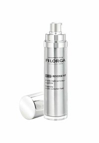 Silver cylindrical bottle with a pump dispenser; clear base showing product, labeled for NCEF Reverse Mat; sleek, modern design.