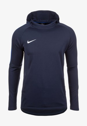 Sweat à capuche Nike bleu foncé manches longues avec un logo swoosh blanc sur la poitrine gauche et une coupe athlétique ajustée.