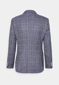 Marinblå rutigt kavaj med en strukturerad tyg, enkel slits och två knappar på ärmarna som har silverknappar, sedd bakifrån.