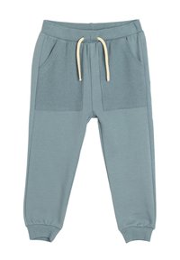 Pantalones de chándal azul claro con bolsillos frontales acanalados, cintura elástica, cordón crema y puños ajustados. Fabricados en suave material de algodón.