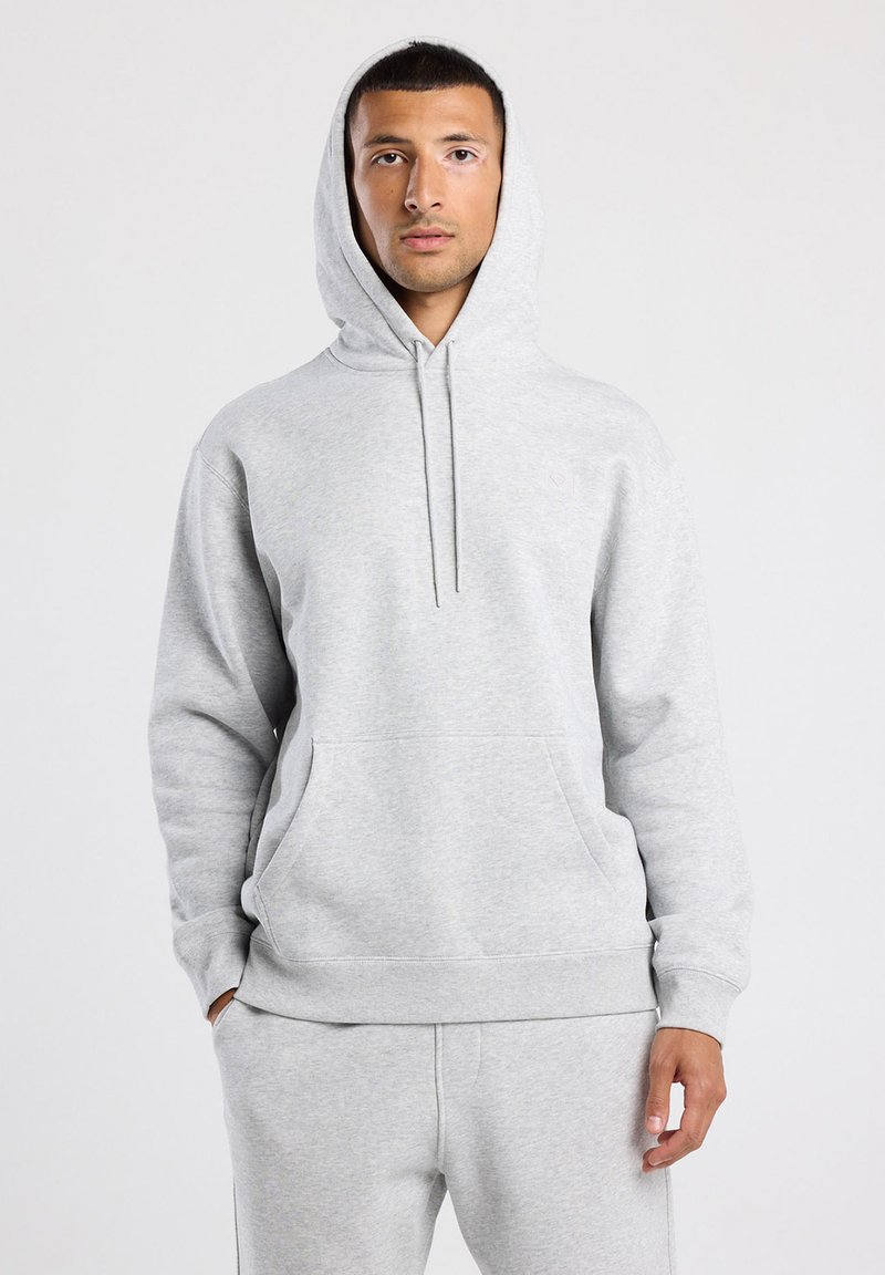 Grey cotton hoodie with a front kangaroo pocket, drawstring hood, and ribbed cuffs. Smooth texture and relaxed fit. No visible branding.