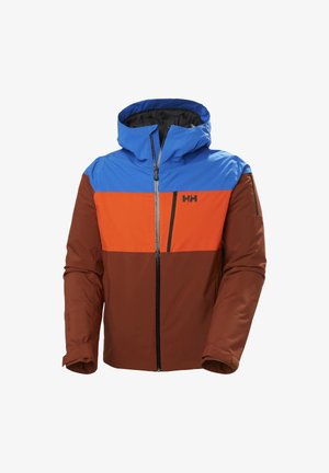 Chaqueta con bloques de color que presenta una parte superior azul, un medio naranja y secciones inferiores marrones. Hecha de un material suave con cierre de cremallera en la parte delantera y capucha.