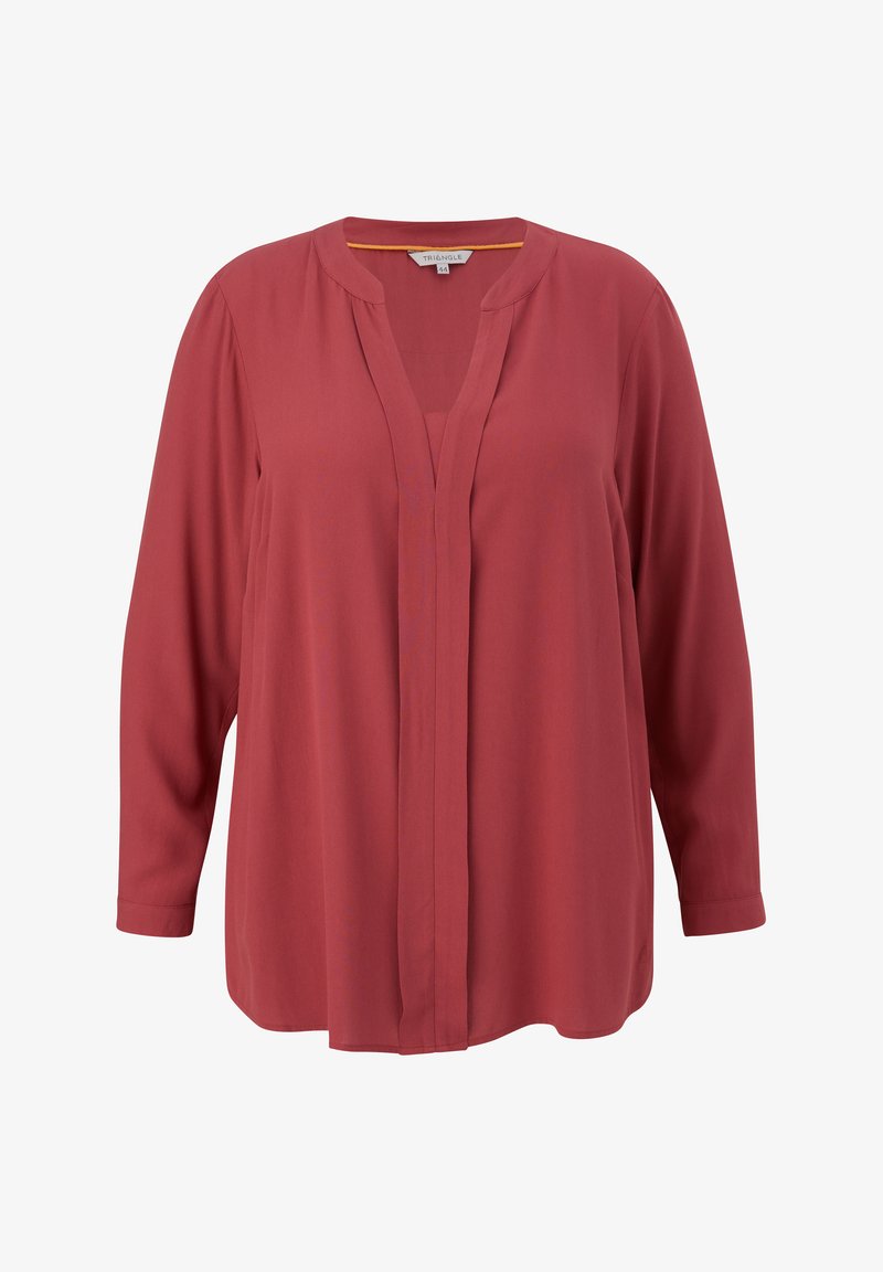 Crvena bluzica s dugim rukavima i V-izrezom. Glatka tkanina bez dugmadi na prednjem dijelu. Opširan kroj i zakrivljeni rub.