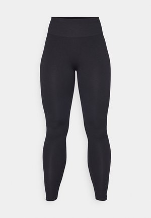 Sorte høyhalsede leggings laget av elastisk materiale med en jevn tekstur. Designet er kroppsnært og sømløst uten synlige logoer eller mønstre.