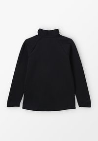 Zwarte pullover met een hoge kraag, lange mouwen en een relaxte pasvorm. Gemaakt van een zachte, gestructureerde stof met raglan-mouwen.