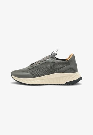 Men's low-top grey sneaker with knit and leather upper, beige chunky sole, and BOSS logo on side and heel.
