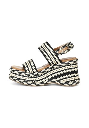 Sandali platform tessuti in bianco e nero con ampie cinghie e chiusura con fibbia, caratterizzati da una suola in juta intrecciata testurizzata per una maggiore adesione.