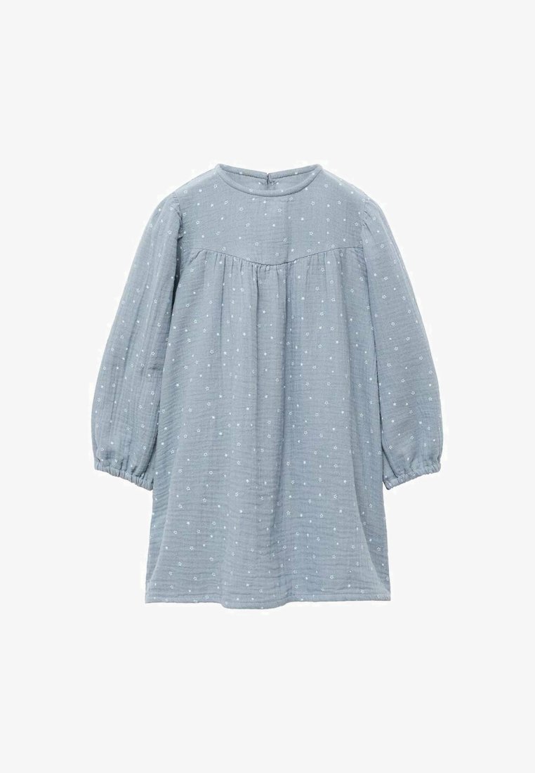Svetlo modra obleka iz teksturirane tkanine. Ima nabran korpus, dolge napihnjene rokave in majhne bele pikice po celotni obleki.