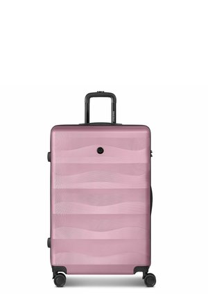 Hard-shell pink suitcase with wavy pattern, telescopic handle, and four spinner wheels positioned upright on a white background.