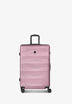 Hartschalenkoffer in Pink mit wellenförmigem Muster, Teleskopgriff und vier drehbaren Rollen, aufrecht stehend vor weißem Hintergrund.