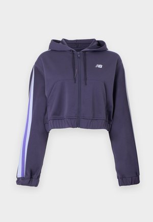 Sweat à capuche raccourci violet avec fermeture éclair, poches avant, capuche, ourlet et poignets élastiques, et rayures bleu clair et blanches sur les manches.