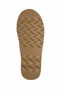 Semelle en caoutchouc brun avec un motif de semelle ondulée, présentant des textures surélevées et des rainures pour une meilleure adhérence, bout arrondi et zone de talon lisse.