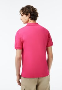 Lacoste Piké - rose fushia sqi