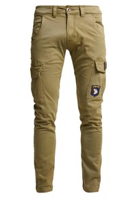 Cargo pants in olive green, made of durable cotton. Features include slim fit, multiple pockets, and an embroidered eagle logo on the side.