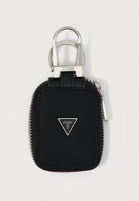Porte-clés en nylon noir avec quincaillerie argentée, fermeture éclair et accent de logo triangulaire. Forme rectangulaire compacte avec finition texturée.