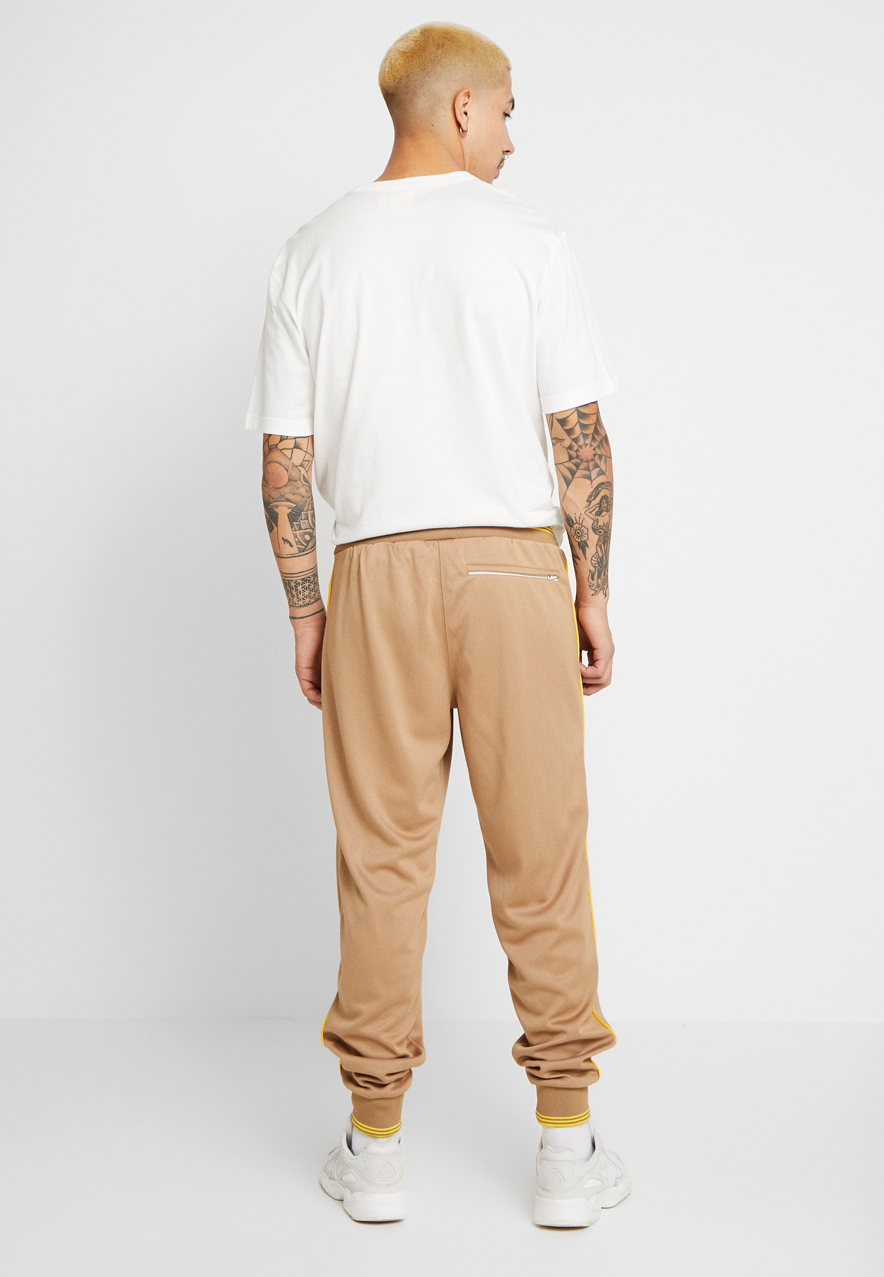 adidas track pants beige