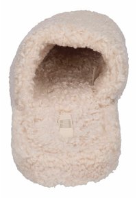 Vlekkige beige pantoffel met een zachte, krullende textuur. Gesloten achterkant, zachte binnenvoering en een platte zool. Etiket zichtbaar aan de binnenkant.