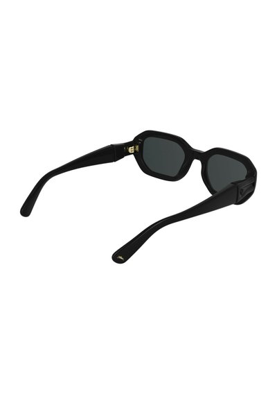 Black octagonal sunglasses with dark lenses, glossy finish, and thin arms. Gold accent on the hinge adds detail to the minimalist design.