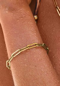 Next Armband - gold tone