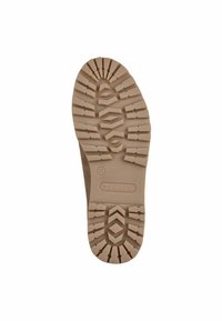 Suela de zapato de goma color beige claro con un patrón texturizado y multi-diseño para mejorar el agarre y la estabilidad. Tamaño 37 marcado en el lateral.