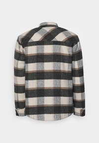 Geruit overhemd van zachte wolmix met een patroon in zwart, grijs, crème en beige; klassieke kraag, lange mouwen en geribde manchetten met knopen.