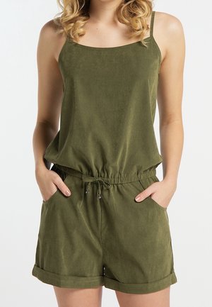 Combinaison sans manches vert olive à coupe ample, taille élastique cintrée et poches latérales. Tissu doux avec une texture lisse.