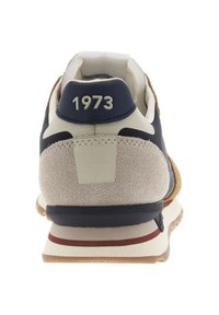 Men's sneaker in navy, beige, and brown suede; features a cushioned heel and '1973' embossed detail. Smooth and textured materials used.