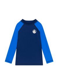 Maglia a maniche lunghe in color blu navy con maniche raglan di un blu brillante. Presenta un piccolo logo di una barchetta bianca sul petto. Tessuto morbido e elasticizzato.