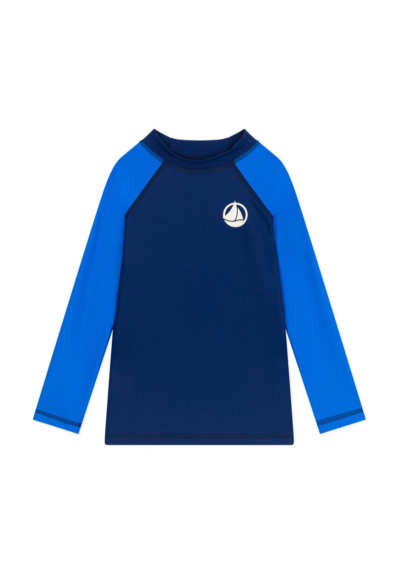 Maglia a maniche lunghe in color blu navy con maniche raglan di un blu brillante. Presenta un piccolo logo di una barchetta bianca sul petto. Tessuto morbido e elasticizzato.