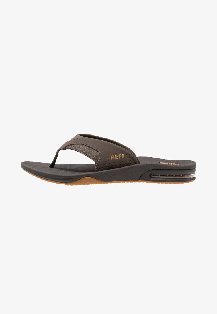 Brown flip-flop with a textured synthetic upper, perforated detailing, cushioned footbed, and rubber outsole with visible air cushioning.