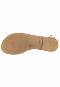 Svijetlosmeđa gumena potplata s teksturiranom površinom. Utisnuti detalji proizvođača. Elegantni dizajn s laganim uzdizanjem na vrhu prsta.