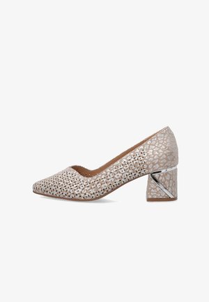 Beige low block heel shoe with metallic animal print pattern, perforated details on upper, and silver geometric accent on heel.